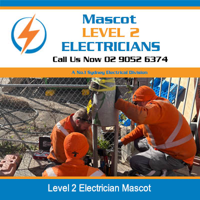 Level 2 electricians working on underground electrical infrastructure at a worksite in Mascot